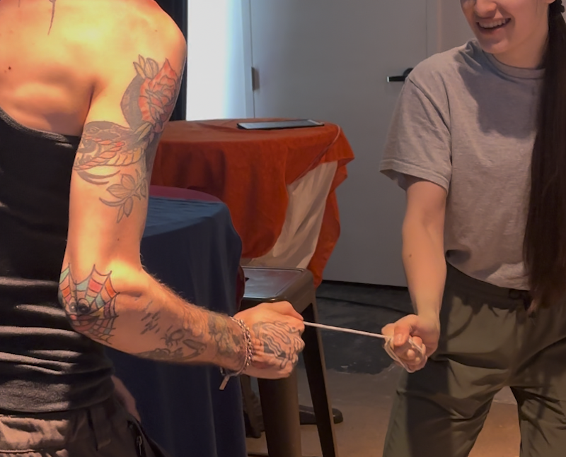Two people playing the string game